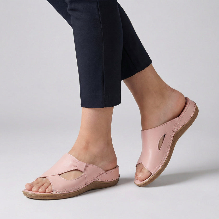 Pink FJØRNA orthopedic open-toe slide sandals for women with cushioned soles and adjustable straps on a neutral background.