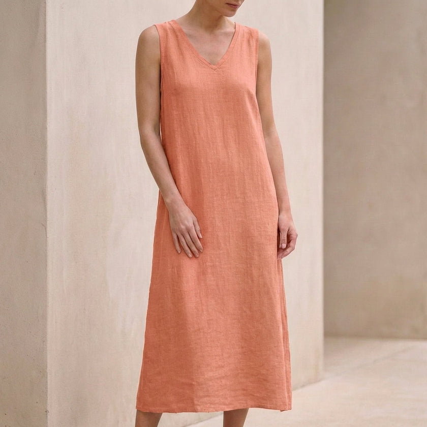 Pink FJØRNA elegant midi dress for women, sleeveless V-neck design, perfect for stylish occasions.