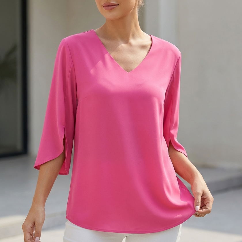 Pink women's V-neck blouse by FJØRNA with curved hem and slit sleeves, flowing and lightweight for a stylish look.
