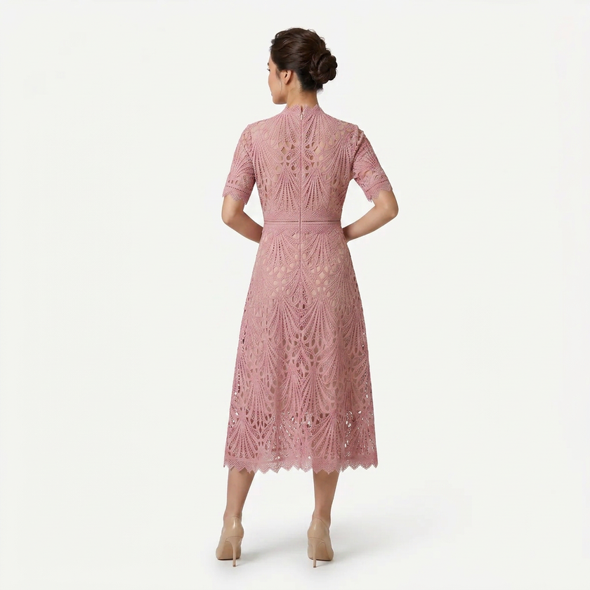 Back view of FJØRNA women's pink lace midi dress with high neck and refined cutwork detail, elegant and feminine silhouette.