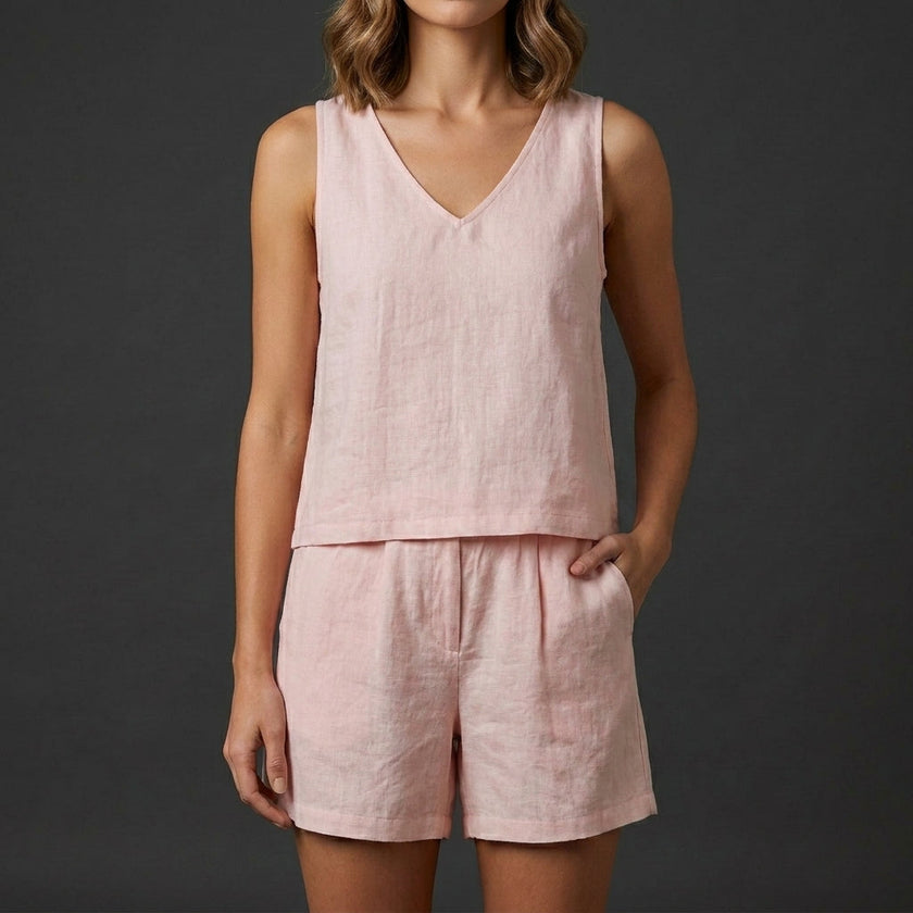 Pink women's summer two-piece co-ord set by FJØRNA featuring a pleated design and V-neck top.