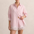 Pink and white relaxed lace-trimmed two-piece shirt and shorts set by FJØRNA with a classic collar, perfect for casual wear.