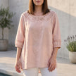 Pink linen summer blouse for women by FJØRNA featuring stylish cut-out design and lightweight fabric.