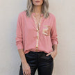 Pink FJØRNA women's summer blouse with V-neck, denim fabric, and button front, stylish top for warm weather.