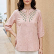 Pink denim flowy summer blouse for women by FJØRNA, lightweight top with relaxed fit and stylish design.