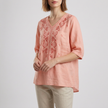 Pink floral linen summer blouse for women with V-neck and slit detail, by FJØRNA, styled as a lightweight, breezy top.