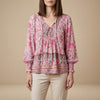 Pink floral long sleeve linen summer blouse for women by FJØRNA, showcasing a lightweight, feminine top with a relaxed fit.
