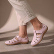 Pink FJØRNA orthopedic closed-toe sandals with cutout details and a comfortable fit, showcasing stylish and supportive footwear.