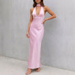 Pink FJØRNA bodycon halter neck maxi dress for women, figure-hugging design with a stylish halter neckline.