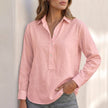 Pink V-neck popover shirt for women with cuffed sleeves and relaxed fit by FJØRNA, shown on a model.