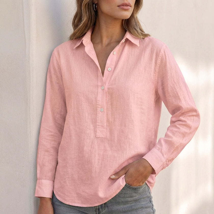 Pink V-neck popover shirt for women with cuffed sleeves and relaxed fit by FJØRNA, shown on a model.