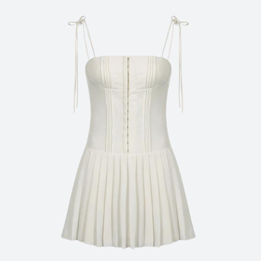 FJØRNA white pleated corset mini dress with structured bodice and flared skirt, perfect for stylish occasion wear.