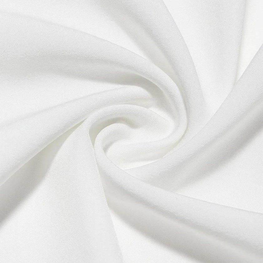 White pleated corset mini dress by FJØRNA, showcasing a fitted bodice, pleated detailing, and stylish mini length.