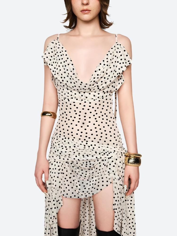 FJØRNA polka dot women's mini dress showing a stylish, short dress with a playful polka dot pattern, perfect for parties and daytime wear.