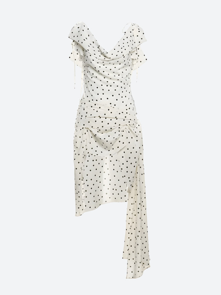 FJØRNA polka dot women's mini dress featuring a playful pattern, suitable for party and day wear, shown on a model.