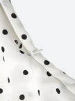 FJØRNA polka dot women's mini dress featuring a stylish party and day wear design, with a fitted silhouette and playful pattern.