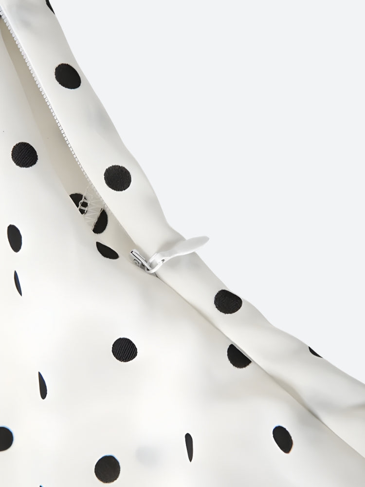 FJØRNA polka dot women's mini dress featuring a stylish party and day wear design, with a fitted silhouette and playful pattern.