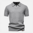 Men's slim fit knit polo shirt by FJØRNA, lightweight and breathable, shown in a casual fit on a model.