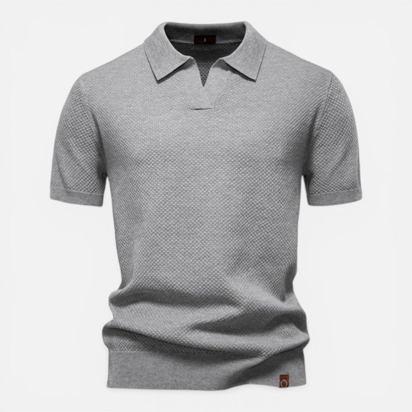 Men's slim fit knit polo shirt by FJØRNA, lightweight and breathable, shown in a casual fit on a model.