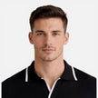 Men's lightweight, breathable slim fit summer polo shirt by FJØRNA, showing the soft knit fabric and classic collar design.