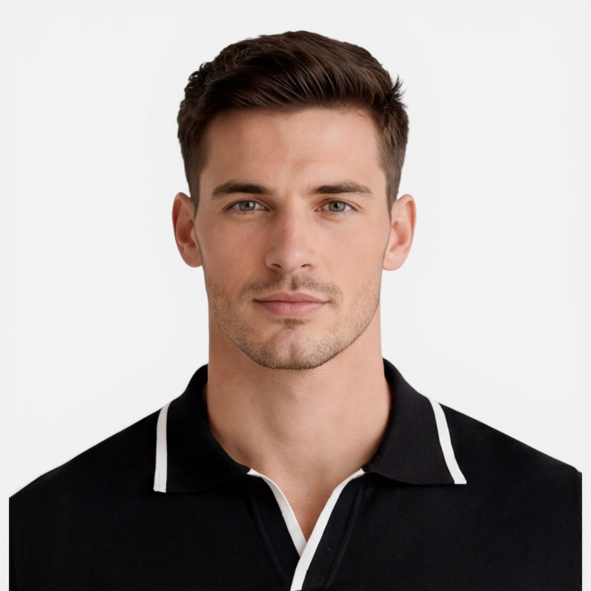 Men's lightweight, breathable slim fit summer polo shirt by FJØRNA, showing the soft knit fabric and classic collar design.