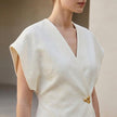 FJØRNA women's fitted wrap-front V-neck blouse with sculpted waist embellishment, casual elegant top for women.