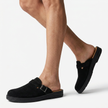 FJØRNA men's PU leather mule clogs with buckle strap, slip-on casual flat shoes shown on model's legs to feet.