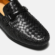 Close-up of men's woven leather slip-on driving loafers by FJØRNA, showcasing the detailed woven design and sleek leather finish.