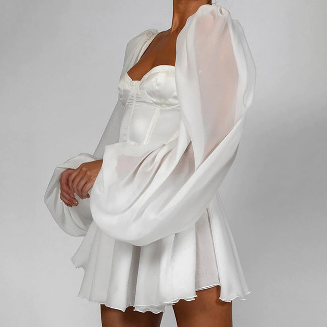 White princess corset dress by FJØRNA featuring a fitted bodice and flowing skirt, stylish Y2K-inspired streetwear look.