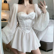 White princess corset dress by FJØRNA featuring a fitted bodice and flowing skirt, styled for streetwear and Y2K fashion.