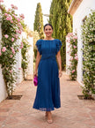 FJØRNA elegant mini dress for women with pleated design, suitable for evening or special occasions.