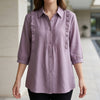 Purple denim ruffle summer blouse for women by FJØRNA, featuring a stylish, lightweight top with ruffled details.