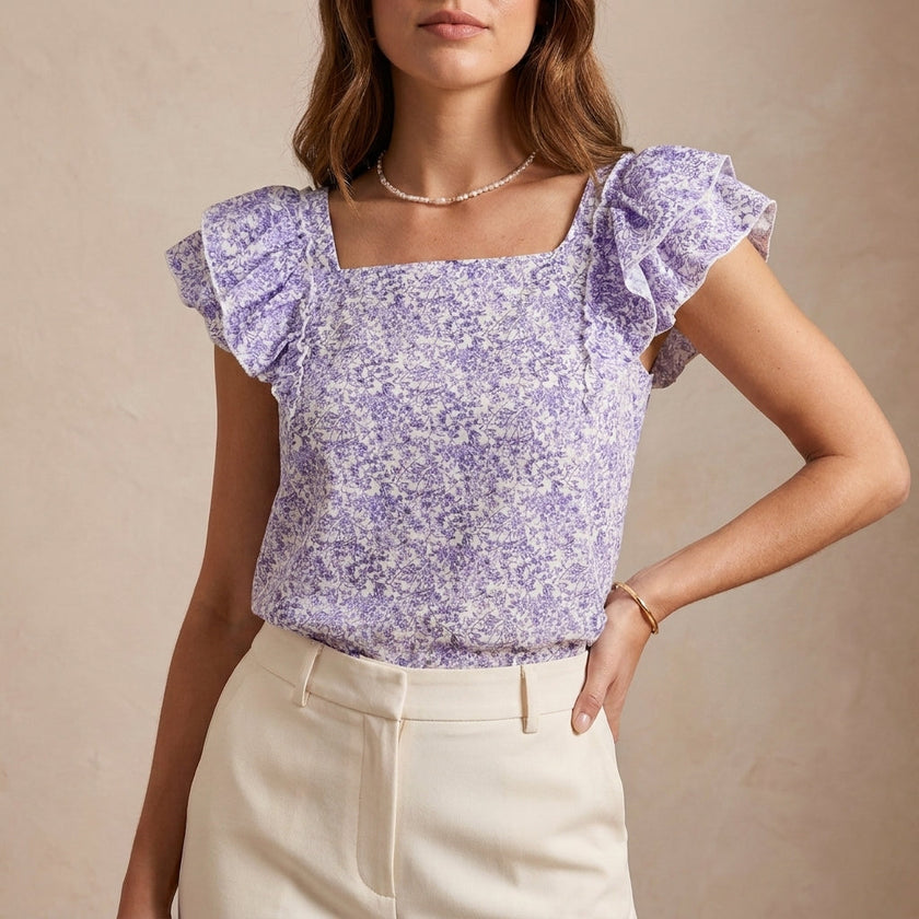 Purple floral summer blouse for women with a square neckline, designed by FJØRNA, showcasing lightweight fabric and stylish fit.