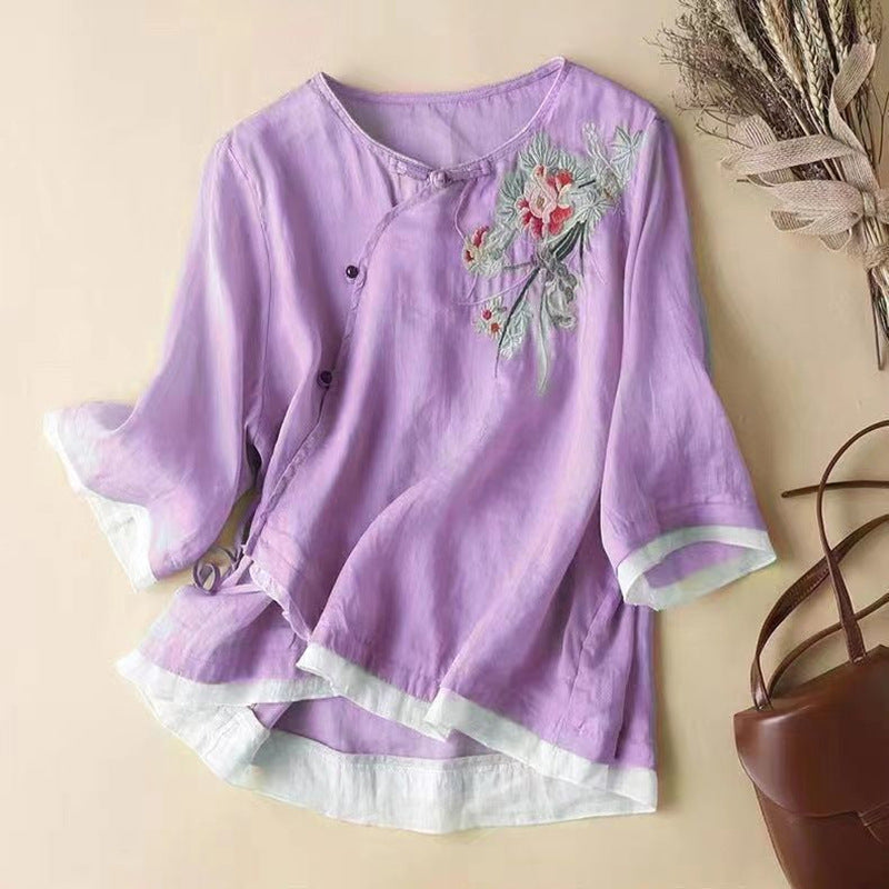 Purple floral V-neck linen summer blouse for women by FJØRNA, featuring a lightweight, relaxed fit.