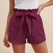 Purple women's summer linen shorts with high waist and front pockets, by FJØRNA, displayed on a plain background.