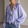 Purple FJØRNA women's summer blouse with V-neck and lace details, stylish sleeveless top for warm weather.
