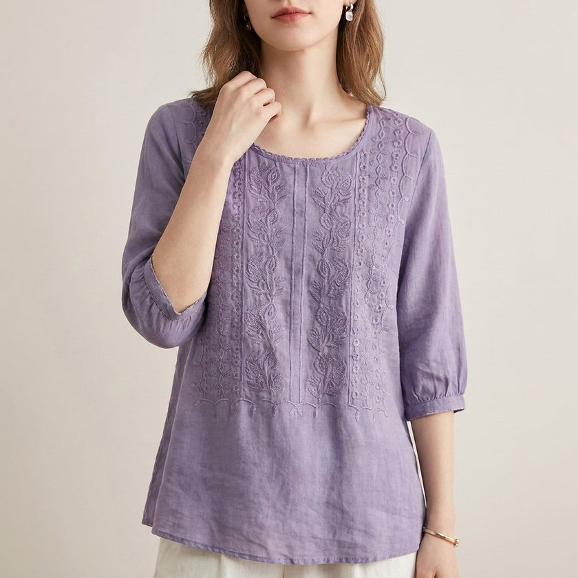 Purple floral V-neck summer blouse for women from FJØRNA, featuring a lightweight, feminine design with a relaxed fit.