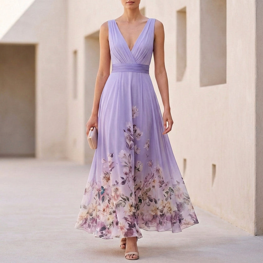 Purple floral FJØRNA sleeveless V-neck A-line maxi dress with a flowy silhouette and elegant floral pattern.