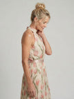 FJØRNA women's floral halter neck midi dress with sleeveless design, perfect for summer, shown in a soft floral pattern.