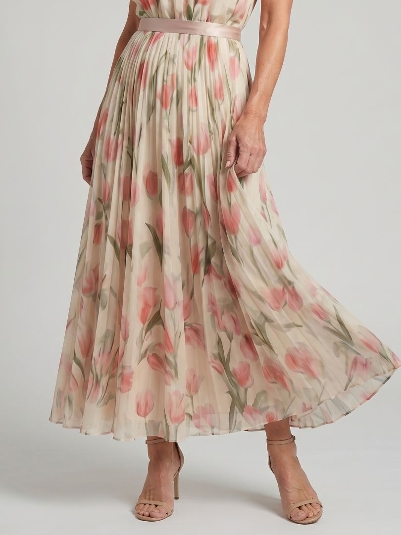FJØRNA floral halter neck midi dress for women featuring a vibrant summer print and flowing silhouette.