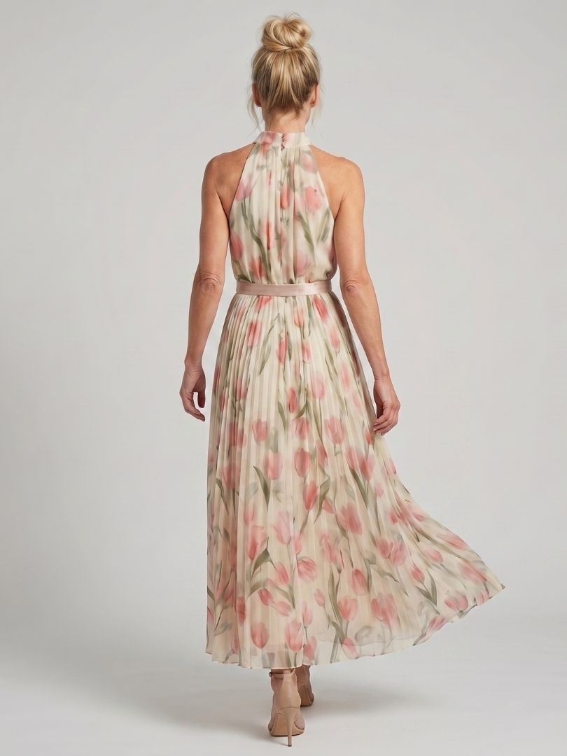 FJØRNA women's floral midi dress with halter neck, featuring a quiet statement design and lightweight fabric for summer wear.