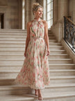 FJØRNA women's floral halter neck midi dress with a quiet statement design, perfect for summer occasions.
