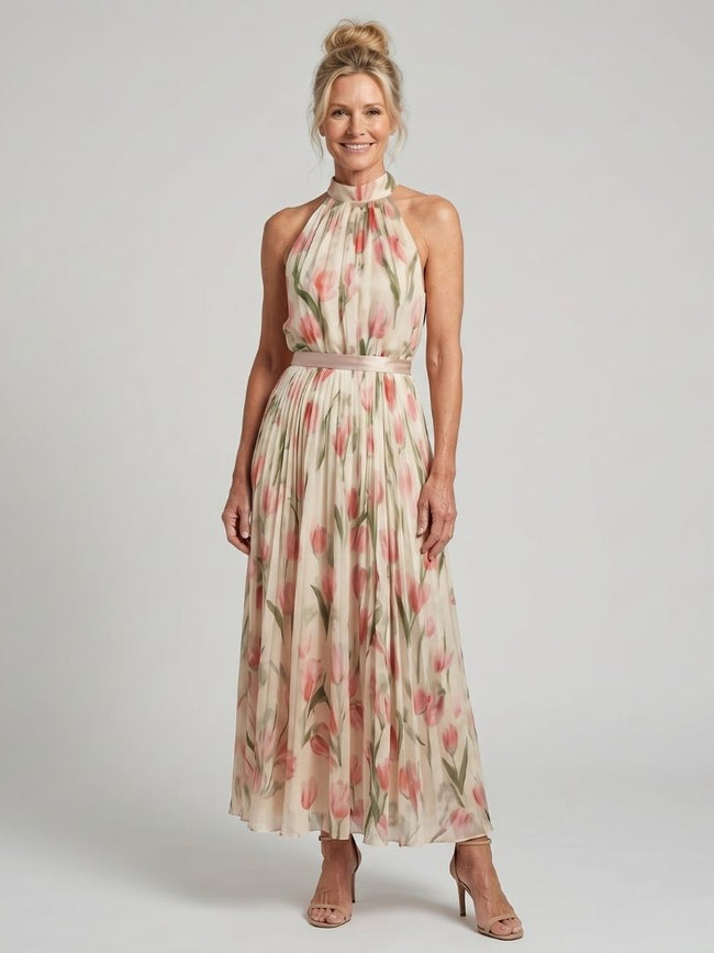 FJØRNA women's floral halter neck midi dress with sleeveless design, perfect for summer, in a vibrant statement print.