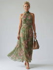 FJØRNA women's floral halter neck summer maxi dress, gathered midi style, featuring a relaxed fit and vibrant floral pattern.