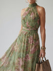 FJØRNA women's floral summer maxi dress with halter neck, gathered design, perfect for warm weather and casual occasions.