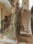 FJØRNA women's summer maxi dress with floral print and halter neck, featuring a gathered design for a stylish, feminine look.
