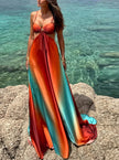 Elegant FJØRNA women's maxi dress with cut-out details, perfect for evening wear, featuring flowing fabric and stylish design.
