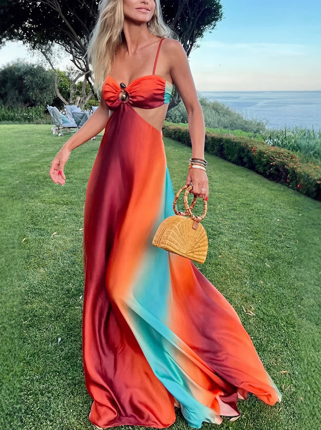 FJØRNA elegant women's maxi dress with cut-out details, suitable for evening wear, featuring a stylish and flowing design.