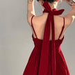 Red velvet halter dress by FJØRNA featuring a fitted silhouette, perfect for stylish streetwear and Y2K-inspired fashion.