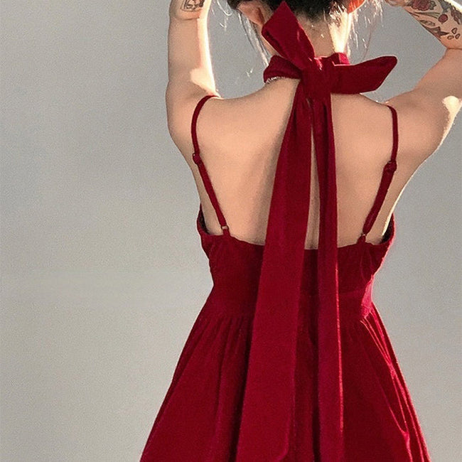 Red velvet halter dress by FJØRNA featuring a fitted silhouette, perfect for stylish streetwear and Y2K-inspired fashion.